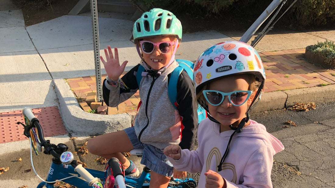 Two girls age 10 and 8 riding bikes 