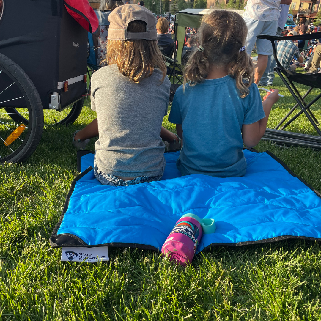 Close-up of the Adventure Mini Mat’s vibrant, textured surface showing detailed stitching and colorful geometric patterns.